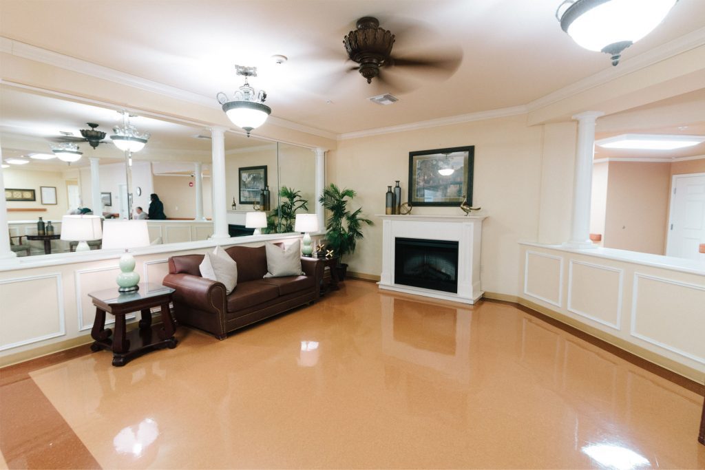 A sitting room with a fireplace available for respite care patients