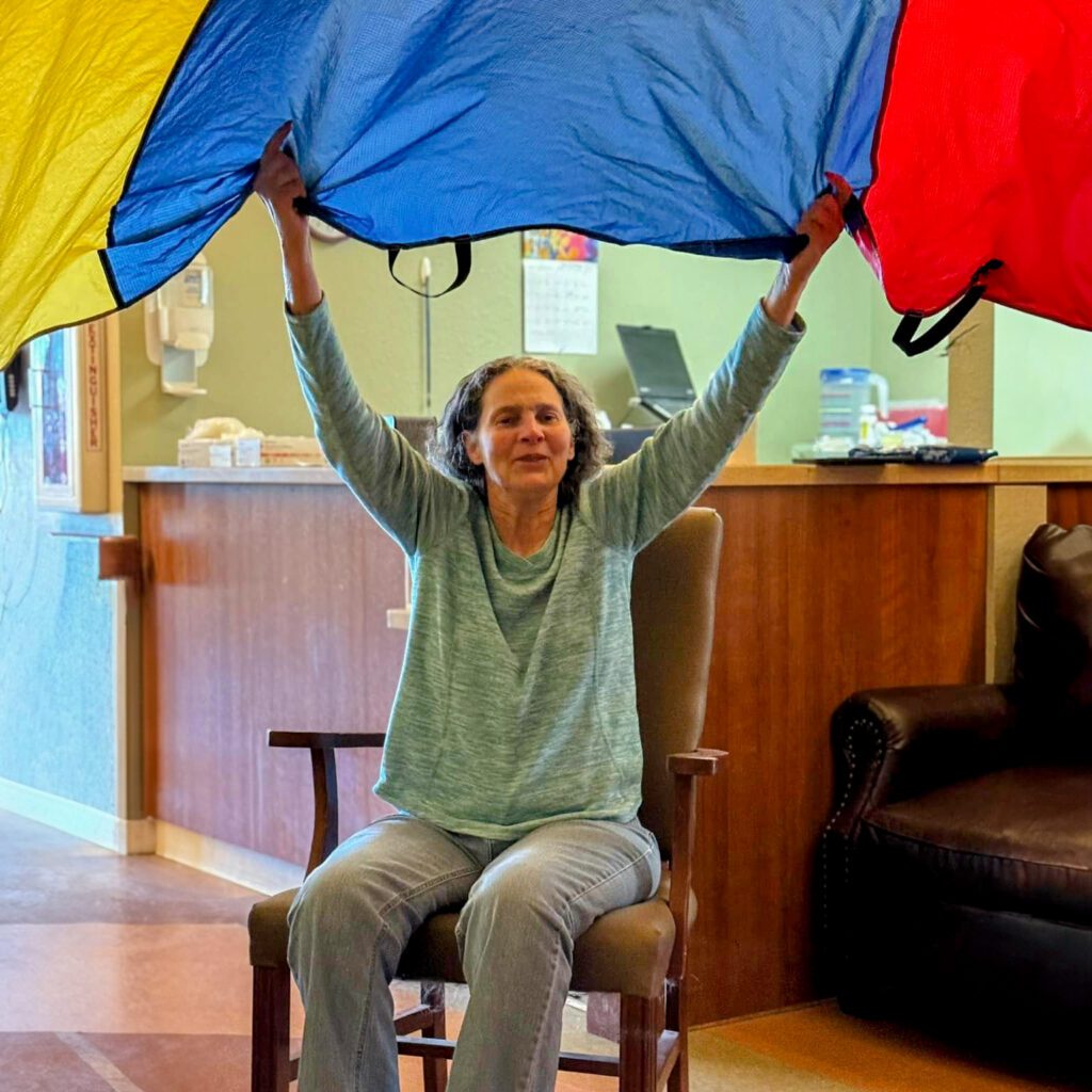 A woman participating in an activity at Edgewood, a skilled nursing facility